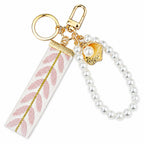 Ribbon keychain with woven detail and faux pearls | KCA055-01 | image 1