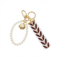 Ribbon keychain with woven detail and faux pearls | KCA055-03 | image 1