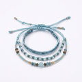Blue braided three-piece bracelet set with adjustable pull cords | BRA567-01 | image 1
