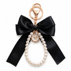 Black bow keychain with faux pearl strand | KCA051-04 | image 1