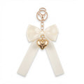 Ivory bow keychain with heart-shaped accent | KCA051-10 | image 1