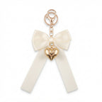 Ivory bow keychain with heart-shaped accent | KCA051-10 | image 1