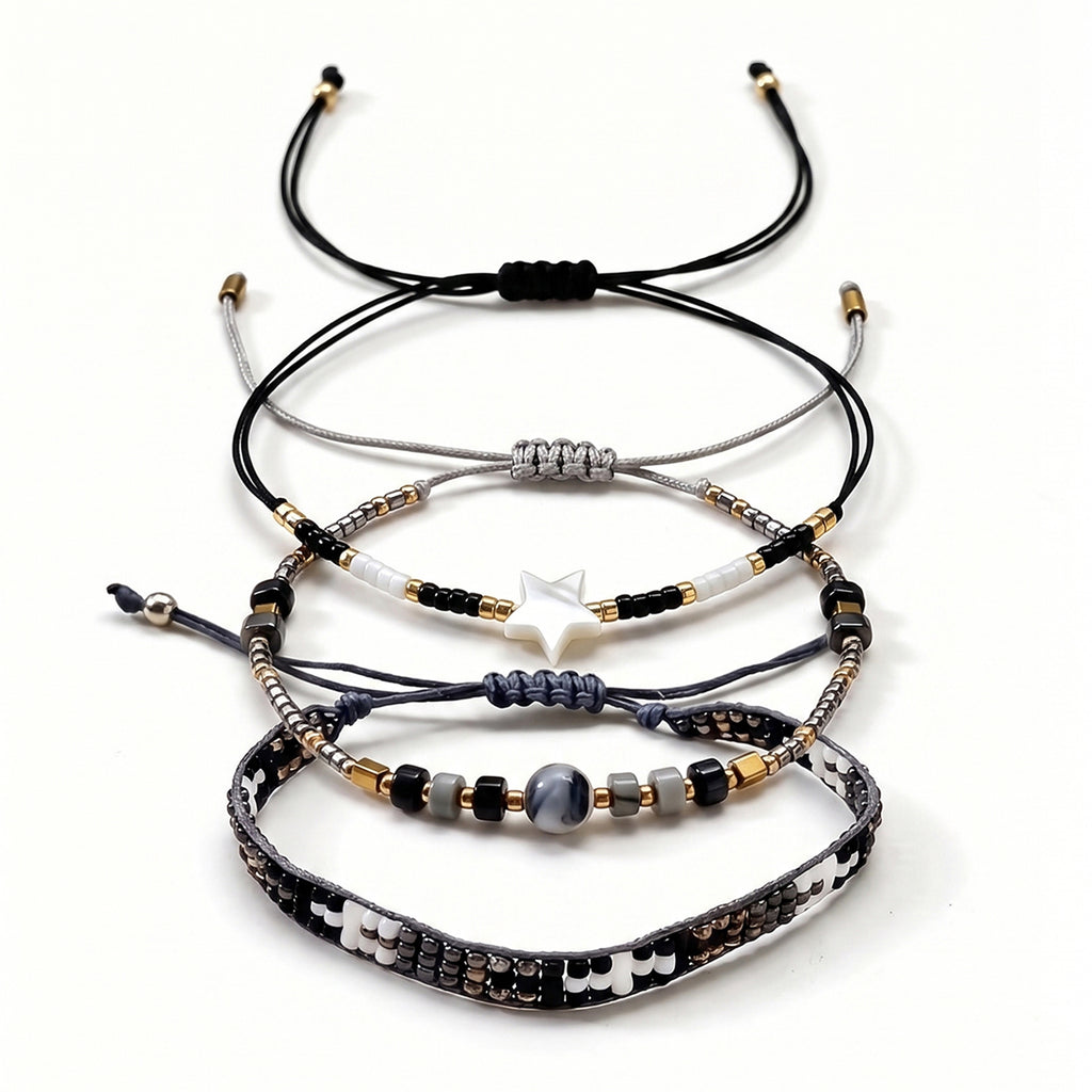 Black, White and Gold-Tone braided three-piece bracelet set with adjustable pull cords | BRA509-01 | image 1
