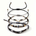 Black, White and Gold-Tone braided three-piece bracelet set with adjustable pull cords | BRA509-01 | image 1