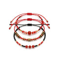 Red braided three-piece bracelet set with adjustable pull cords | BRA514-01 | image 1