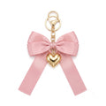 Pink bow keychain with heart-shaped accent | KCA051-06 | image 1