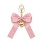 Pink bow keychain with heart-shaped accent | KCA051-06 | image 1