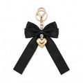 Black bow keychain with heart-shaped accent | KCA051-09 | image 1