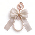 Ivory bow keychain with faux pearl strand | KCA051-05 | image 1