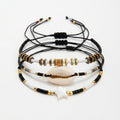Black braided three-piece bracelet set with adjustable pull cords | BRA584-01 | image 1