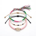 Pink braided three-piece bracelet set with adjustable pull cords | BRA564-01 | image 1