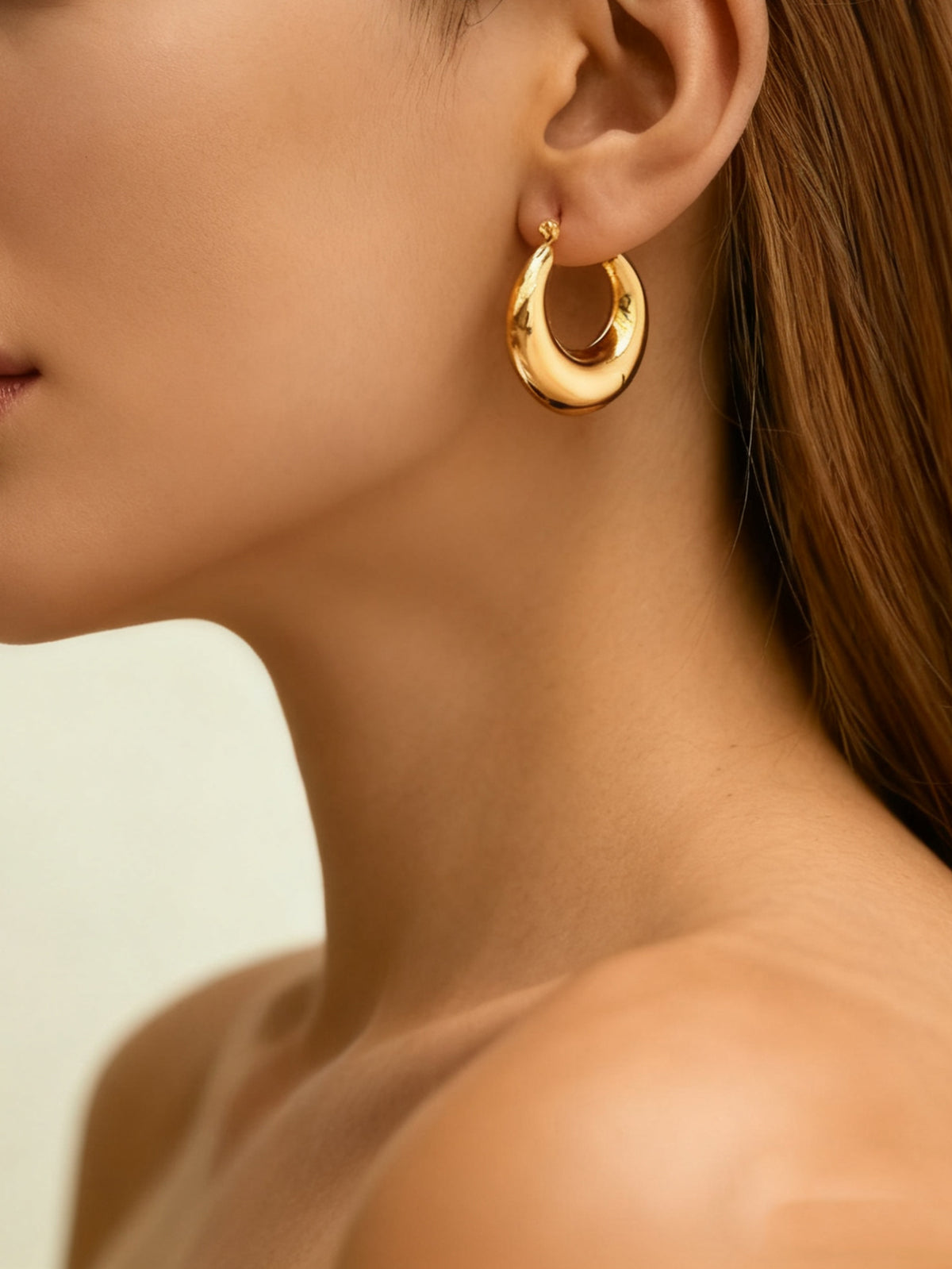 Gold-tone stainless steel U-hoop earrings with polished finish | ERA646-01 | image 2