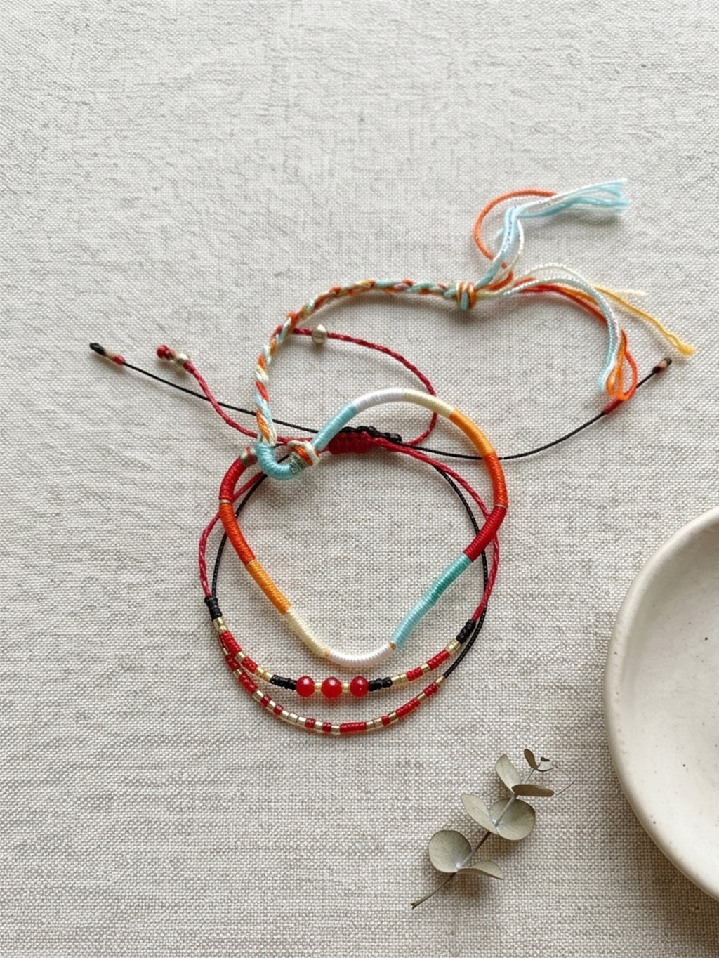 Red braided three-piece bracelet set with adjustable pull cords | BRA575-01 | image 3