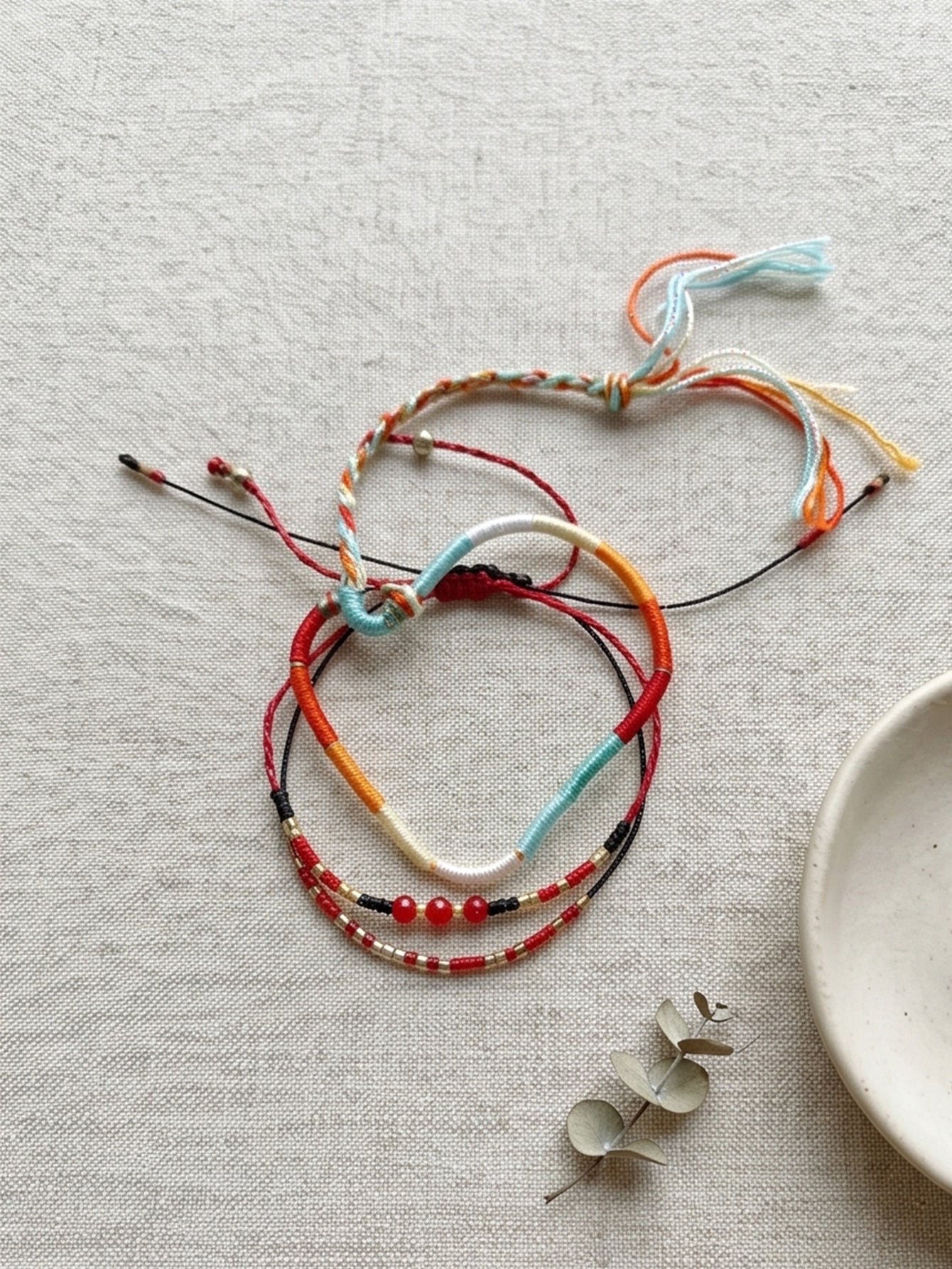 Red braided three-piece bracelet set with adjustable pull cords | BRA575-01 | image 3
