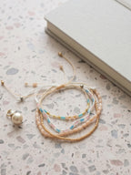 Beige braided three-piece bracelet set with adjustable pull cords | BRA586-01 | image 3