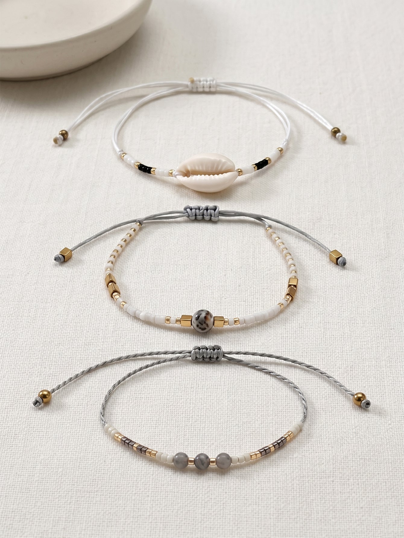 White braided three-piece bracelet set with adjustable pull cords | BRA519-01 | image 3
