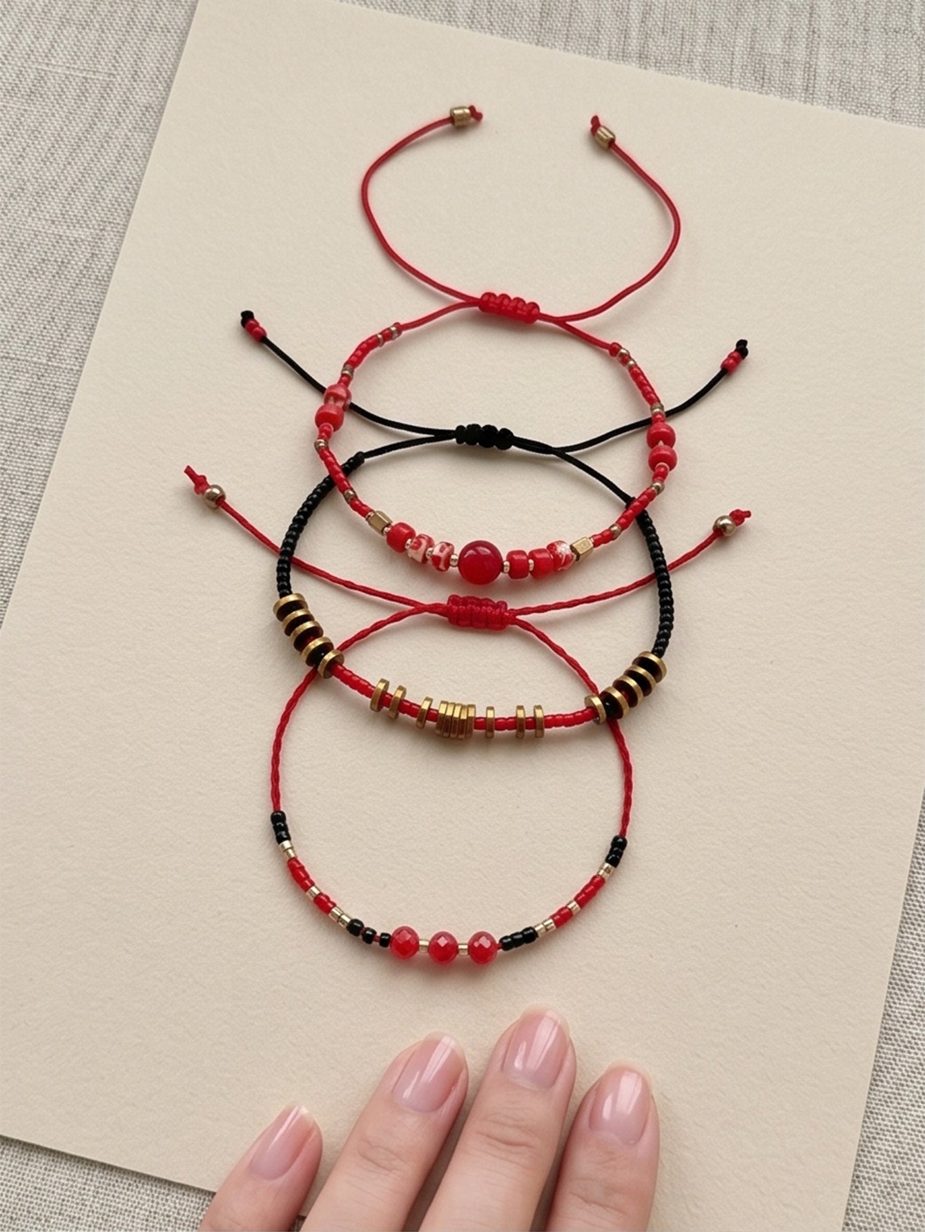 Red braided three-piece bracelet set with adjustable pull cords | BRA514-01 | image 3