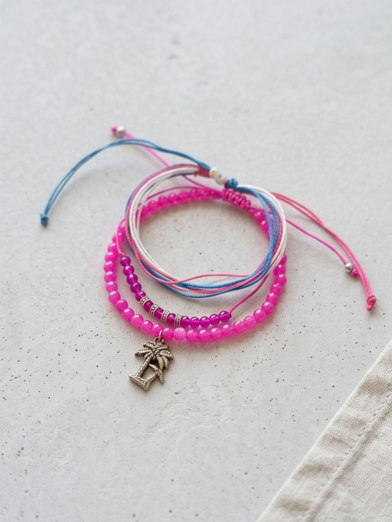 Fuchsia braided three-piece bracelet set with adjustable pull cords | BRA562-01 | image 3