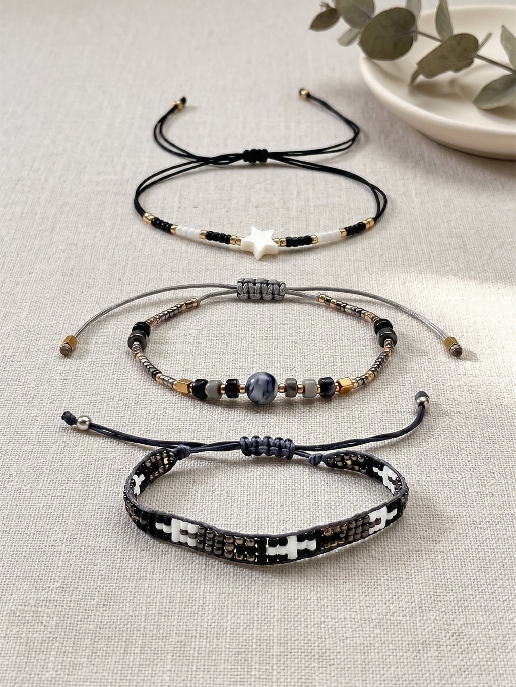 Black, White and Gold-Tone braided three-piece bracelet set with adjustable pull cords | BRA509-01 | image 3