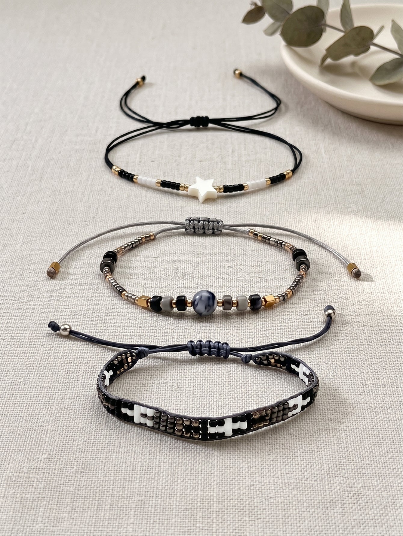 Black, White and Gold-Tone braided three-piece bracelet set with adjustable pull cords | BRA509-01 | image 3
