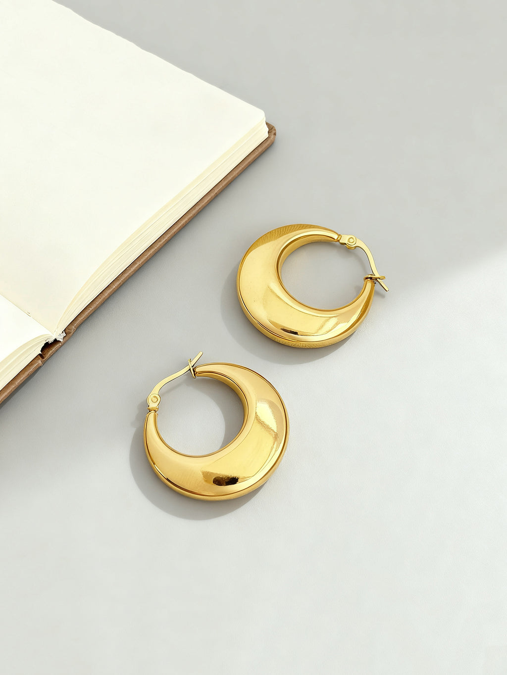 Gold-tone stainless steel U-hoop earrings with polished finish | ERA646-01 | image 3
