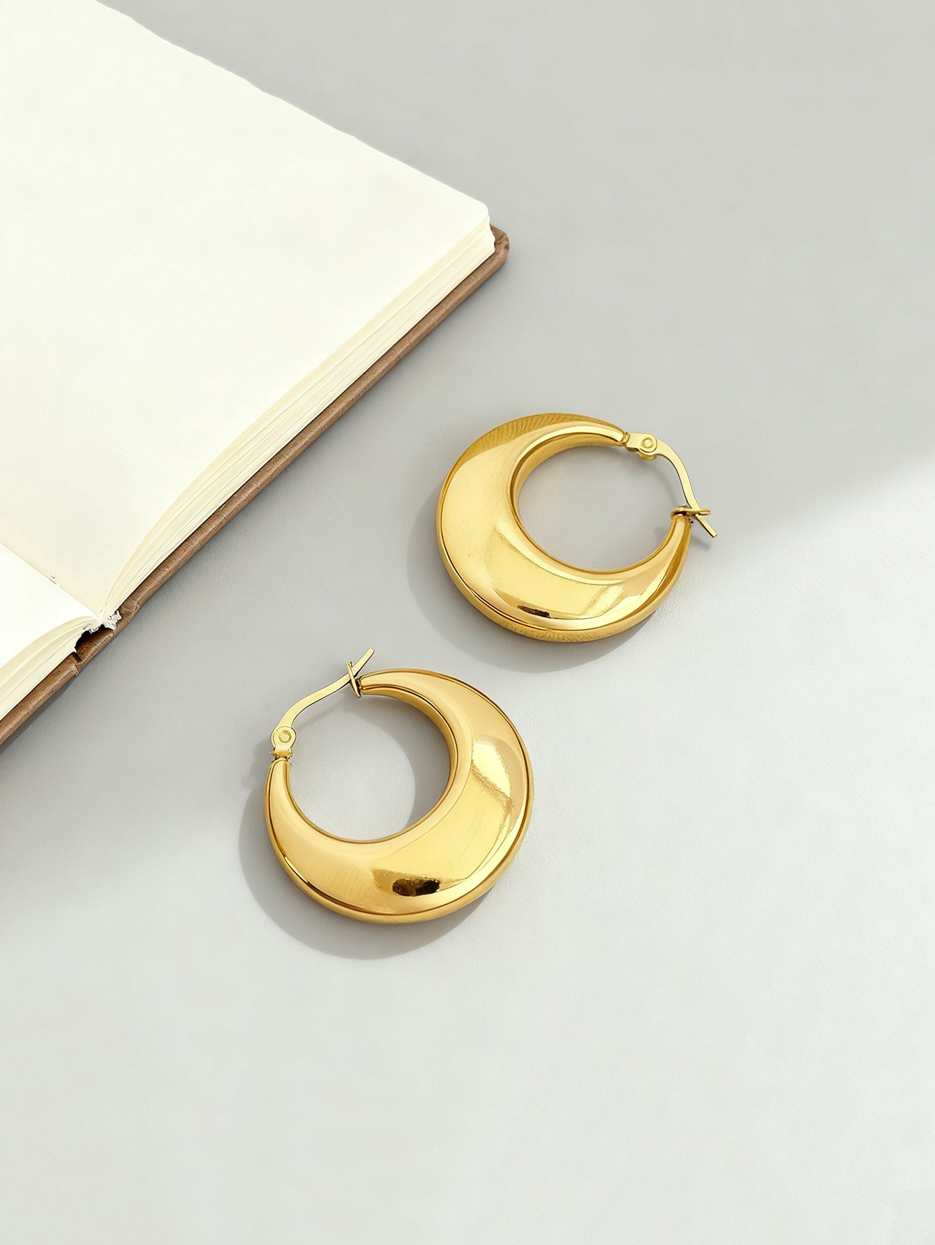 Gold-tone stainless steel U-hoop earrings with polished finish | ERA646-01 | image 3