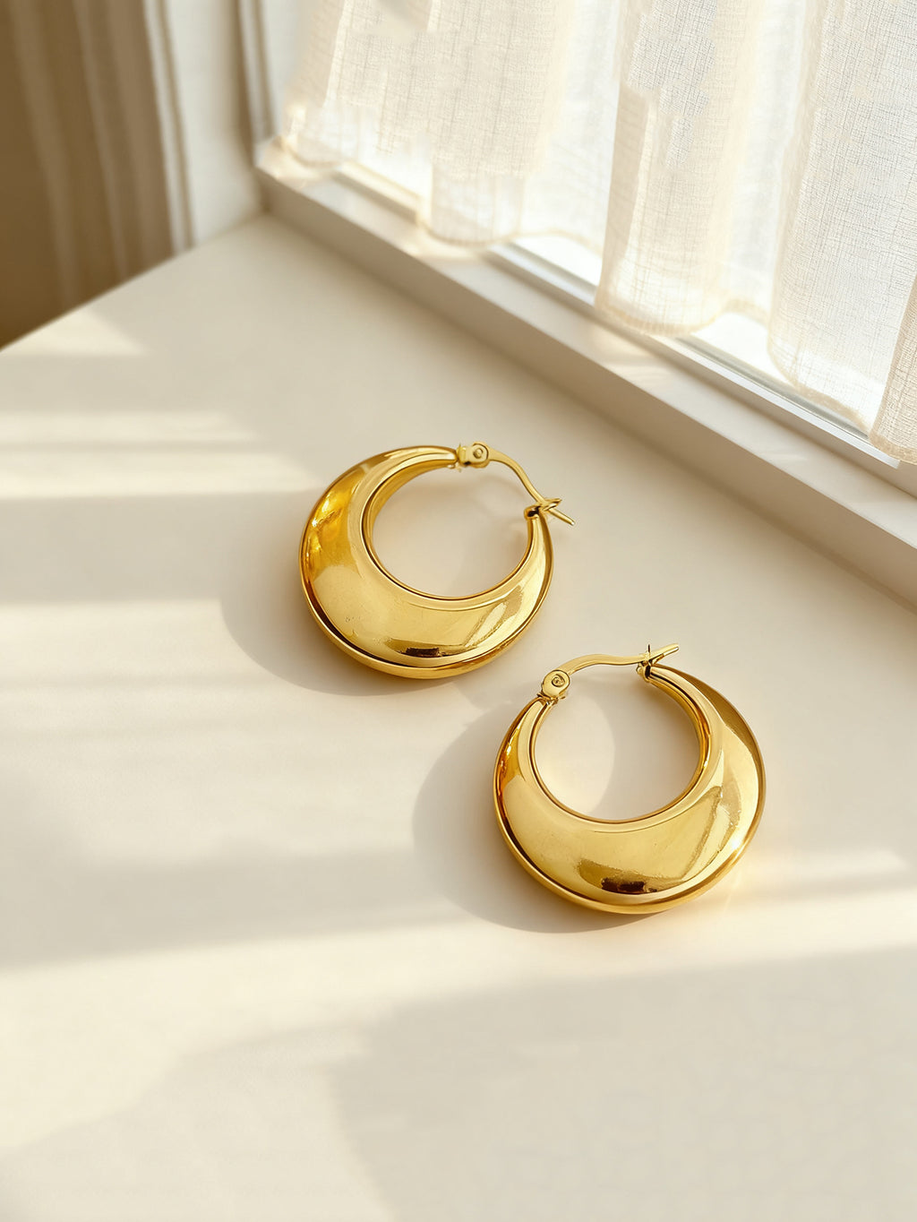 Gold-tone stainless steel U-hoop earrings with polished finish | ERA646-01 | image 4