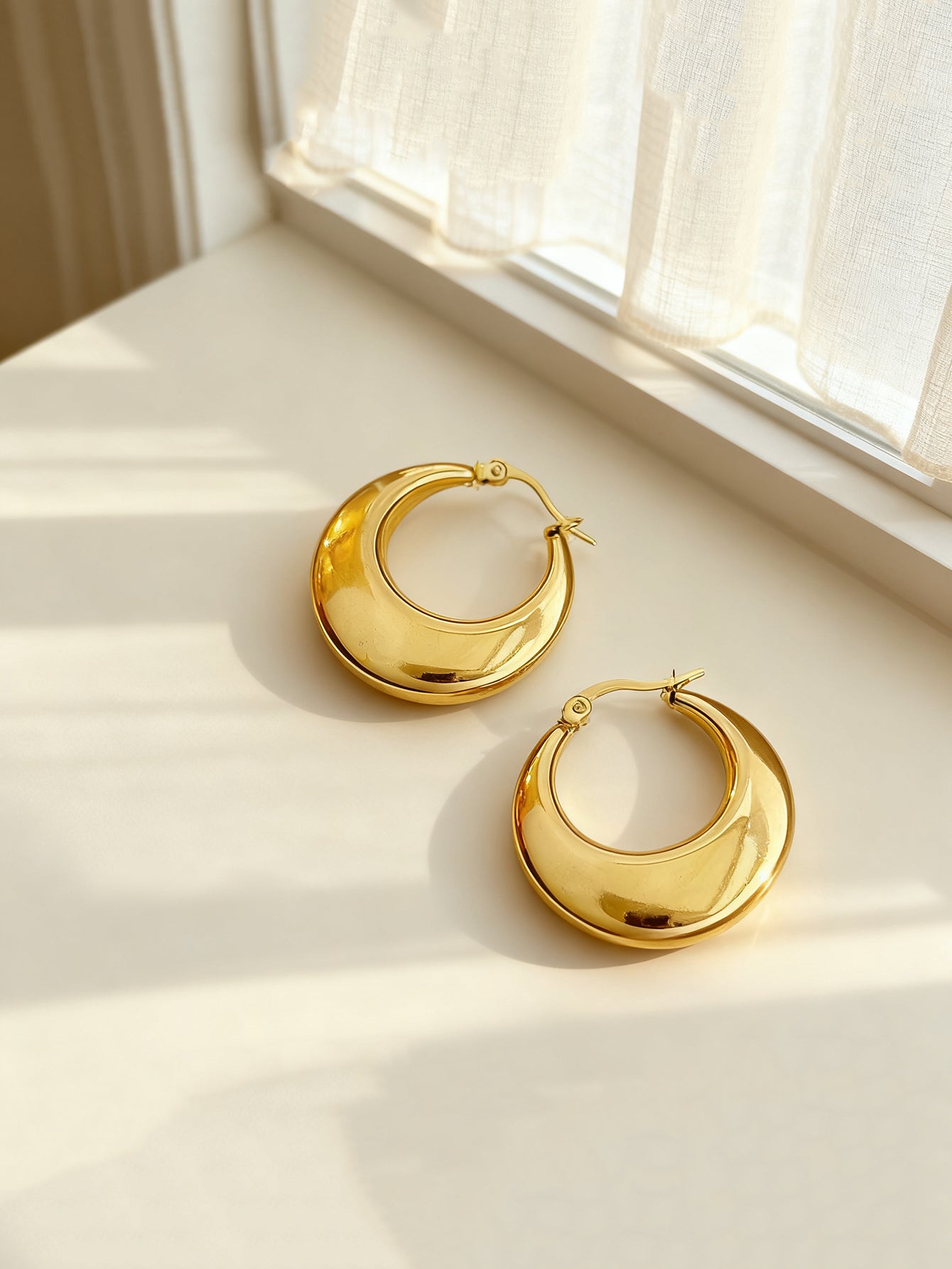 Gold-tone stainless steel U-hoop earrings with polished finish | ERA646-01 | image 4