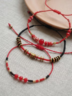 Red braided three-piece bracelet set with adjustable pull cords | BRA514-01 | image 4