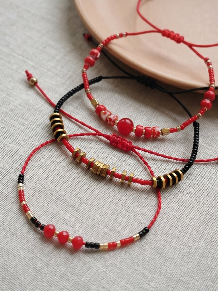 Red braided three-piece bracelet set with adjustable pull cords | BRA514-01 | image 4