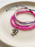 Fuchsia braided three-piece bracelet set with adjustable pull cords | BRA562-01 | image 4