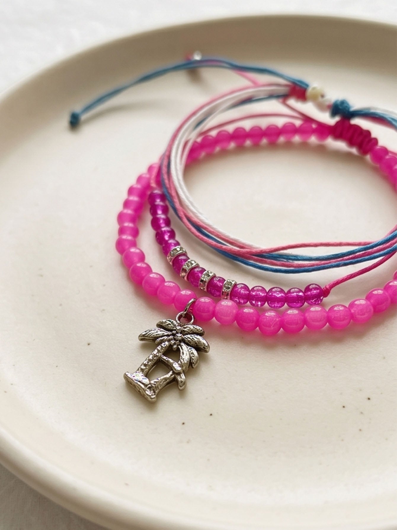 Fuchsia braided three-piece bracelet set with adjustable pull cords | BRA562-01 | image 4