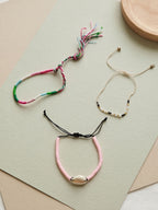 Pink braided three-piece bracelet set with adjustable pull cords | BRA564-01 | image 4