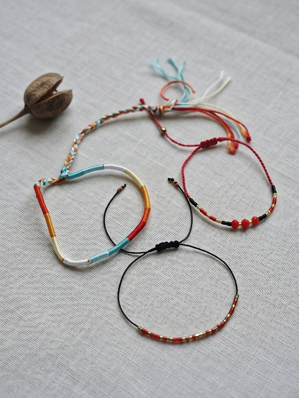 Red braided three-piece bracelet set with adjustable pull cords | BRA575-01 | image 4