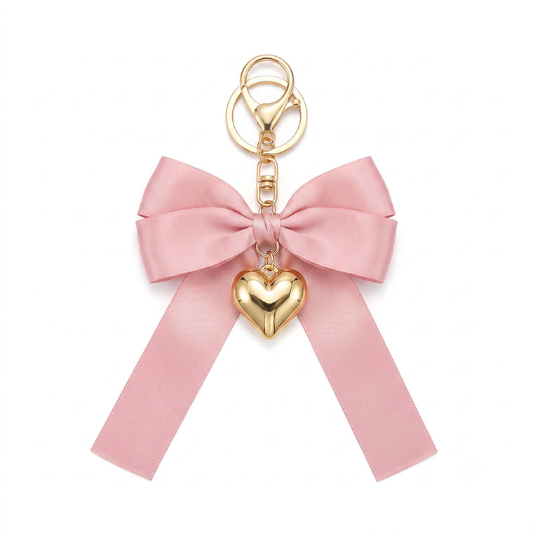 Pink bow keychain with heart-shaped accent