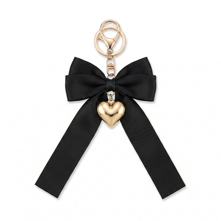 Black bow keychain with heart-shaped accent
