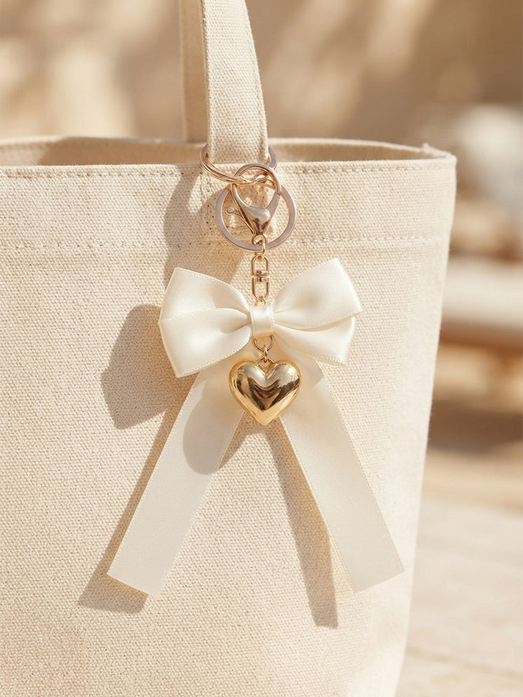 Ivory bow keychain with heart-shaped accent - detail view 3