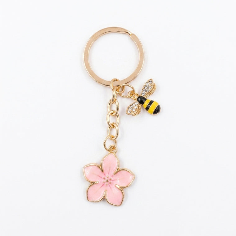 Pink cherry blossom keychain with bee accent