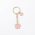 Pink cherry blossom keychain with floral accents