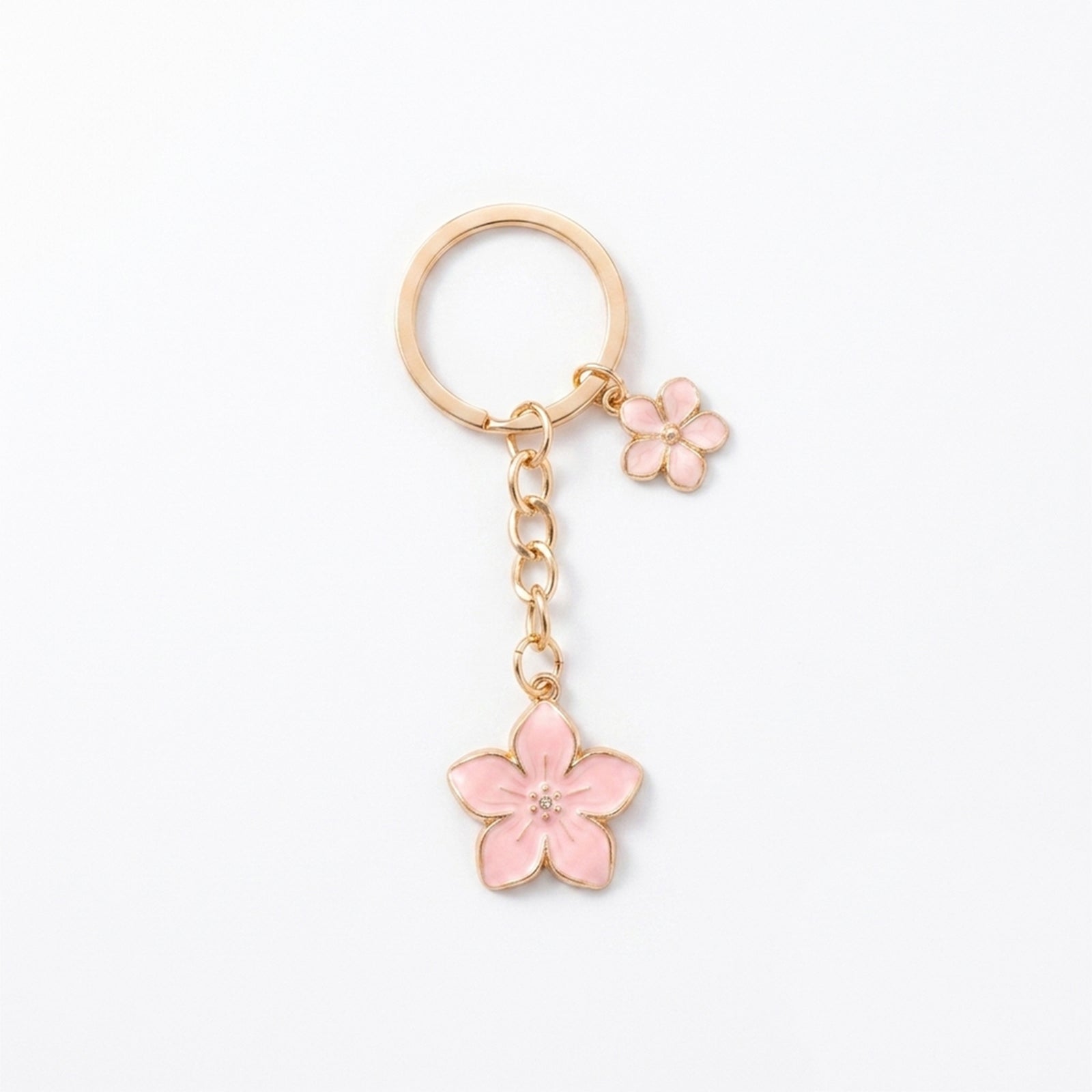 Pink cherry blossom keychain with floral accents