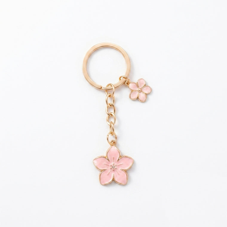 Pink cherry blossom keychain with floral accents