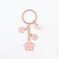 Pink cherry blossom keychain with pearl details