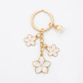 White cherry blossom keychain with pearl details