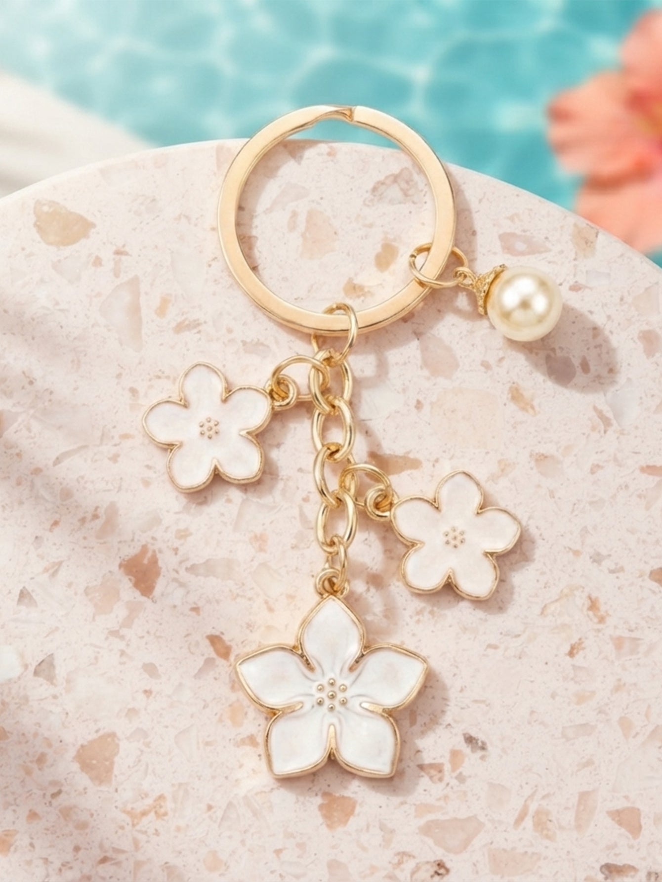 White cherry blossom keychain with pearl details - detail view 1