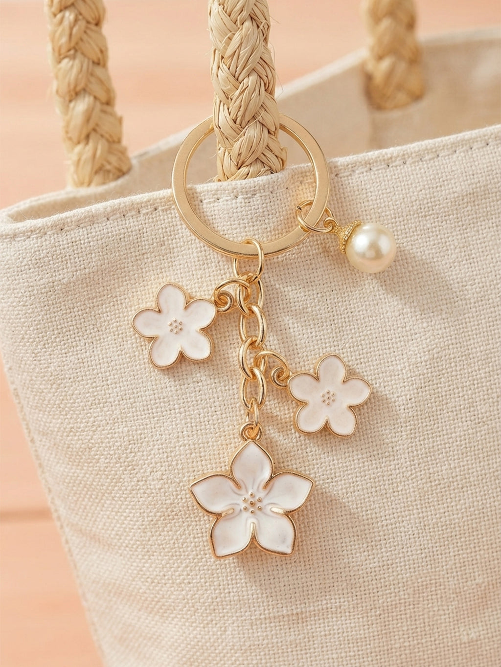 White cherry blossom keychain with pearl details - detail view 2