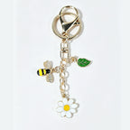Gold-tone bee daisy leaf keychain accessory